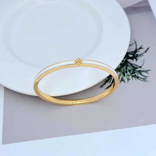 Enamel metal bracelet with gold-tone bangle and sky blue bar detail