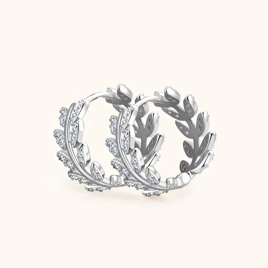 White gold tone leaf motif hoop earrings with round moissanite stones