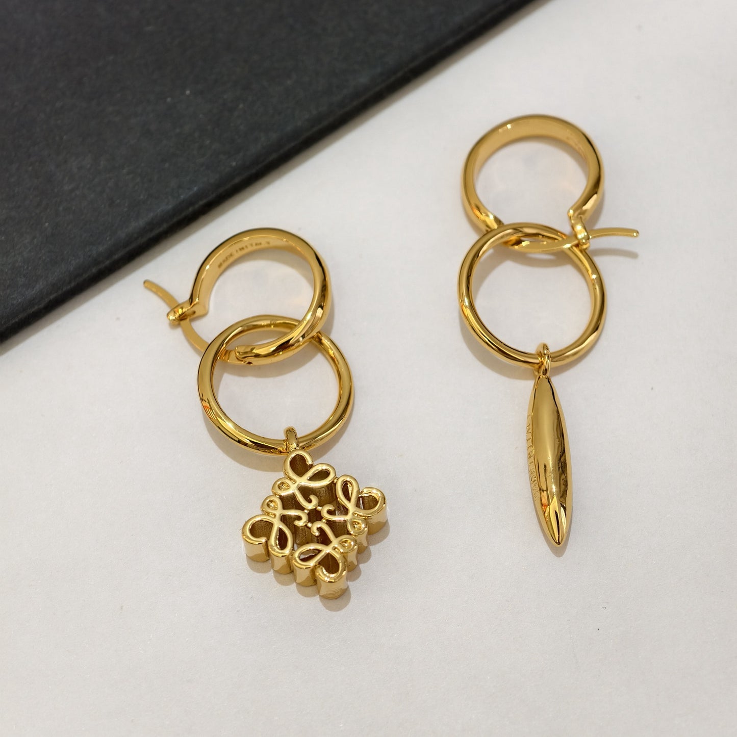 Loewe asymmetrical pendant metal earrings