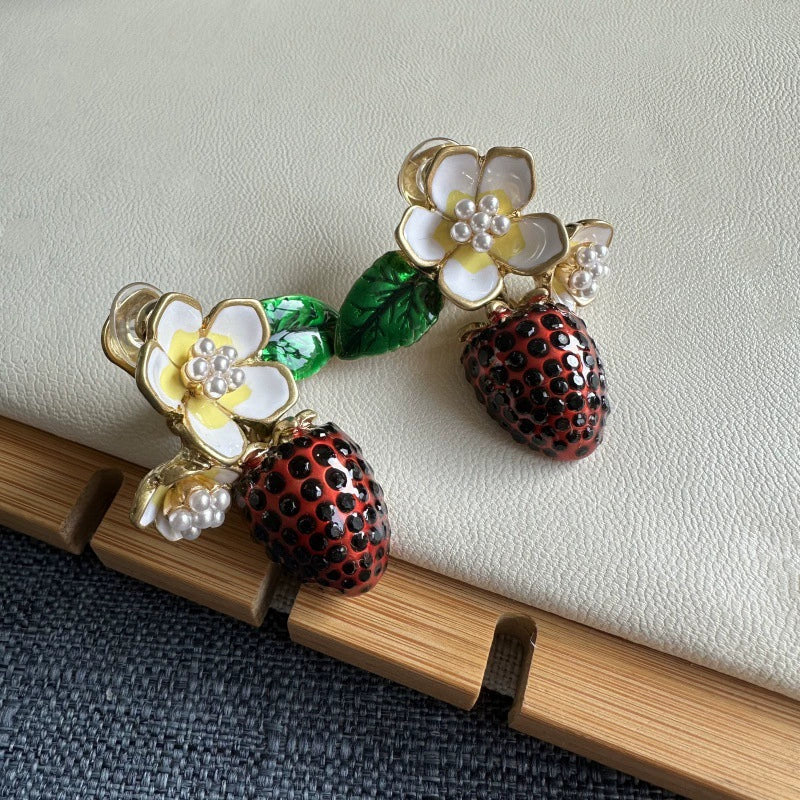 Enamel strawberry pendant clip-on earrings with white blossoms, pearl centers, green leaves