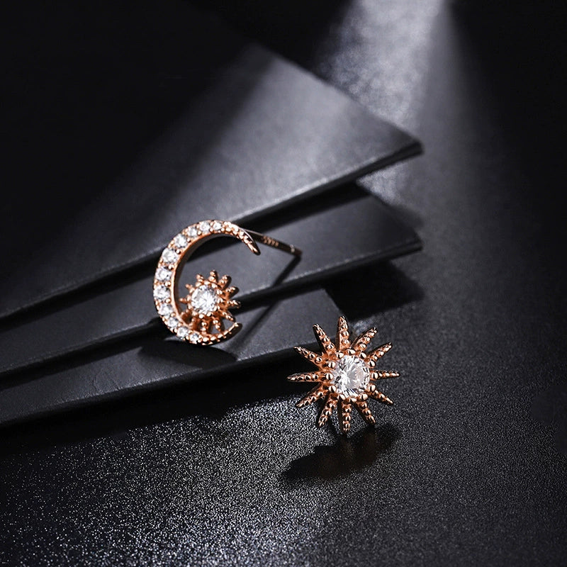 Rose gold tone crescent moon and sunburst diamond stud earrings with pavé