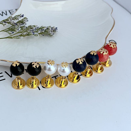 Gold-tone stud earrings with round black, white, deep blue, and red faux pearls