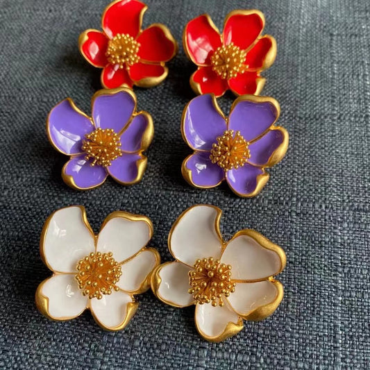 Enamel floral stud earrings set in red, purple, and white with gold-tone petals.