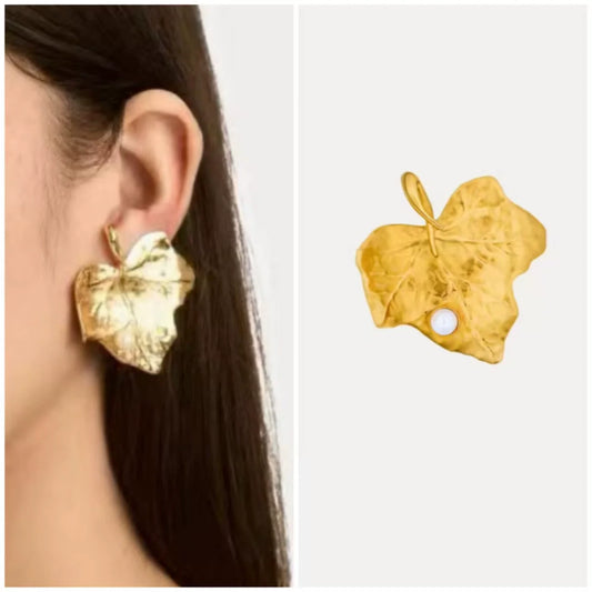 Gold-tone ivy leaf stud earrings with white pearl accents and curled vine shapes