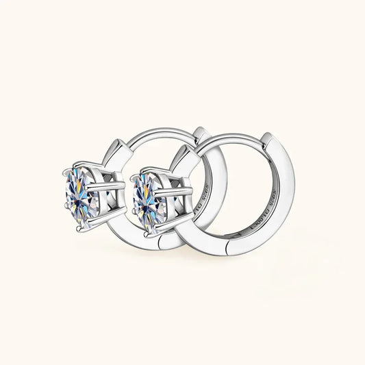 Silver-tone huggie hoop earrings with round solitaire moissanite, prong-set