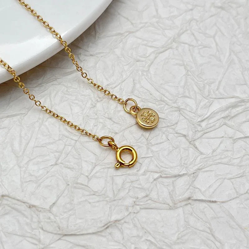 Gold rhinestone necklace chain with round charms and O-ring clasp