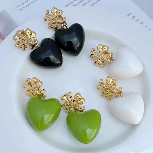 Glossy heart pendant earrings: black and green hearts with gold snowflake studs