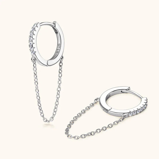 White gold huggie hoop earrings with pavé stones and dangling chain