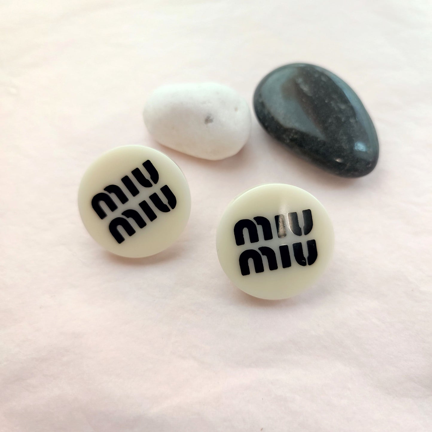 Miu Miu round resin button stud earrings in white with black logo