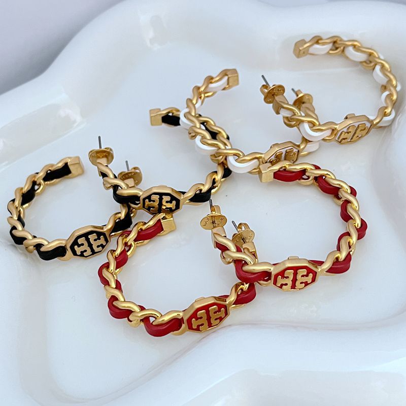 Leather-woven logo hoop earrings with red-and-black leather links and gold-tone logo medallions