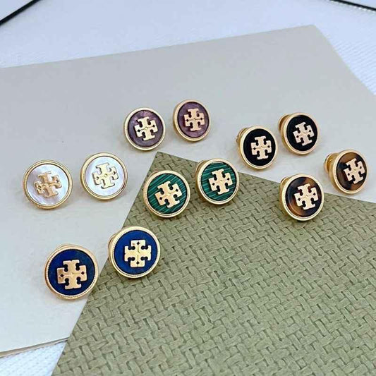 Round stud earrings in multiple colors with gold emblem, gold-tone bezels
