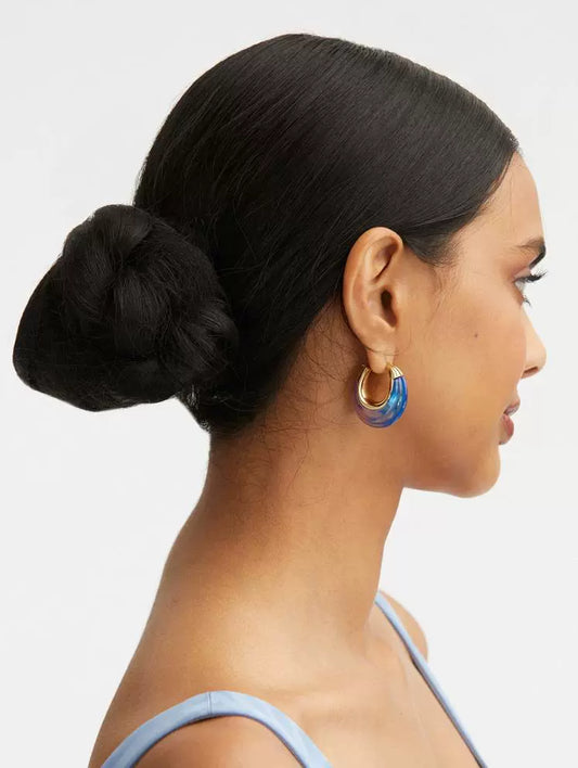 Ombré U-shaped hoop earrings on model, gold-tone edges with blue to purple resin gradient