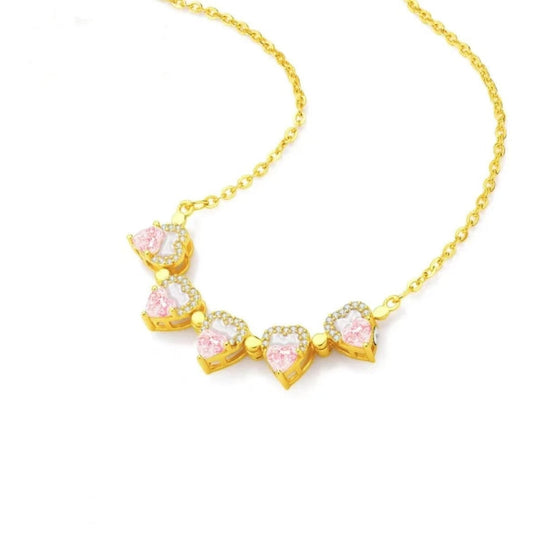 Gold-tone chain necklace with heart-shaped pink charms and clear pavé accents