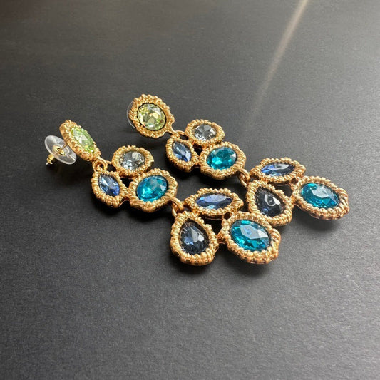 Long blue crystal drop earrings with gold-tone link design and oval stones in mixed hues