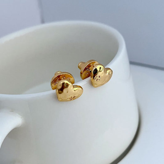 Gold heart stud earrings with front faces and metal stud posts, pair shown
