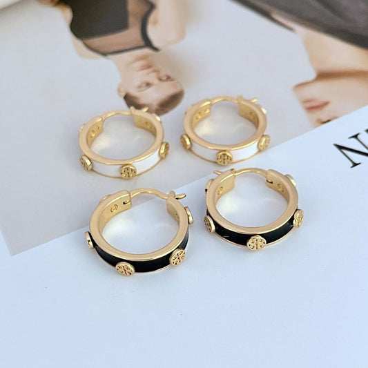 Gold-tone enamel logo hoop earrings with white and black enamel panels
