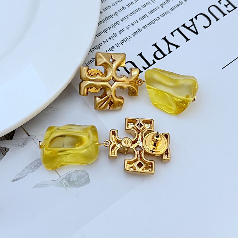 Gold-tone logo pendant earrings with yellow acrylic drop charms, including back hardware