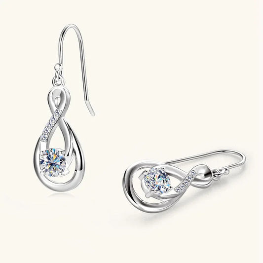 Silver teardrop moissanite earrings with twisted frame and tiny crystal pavé accents