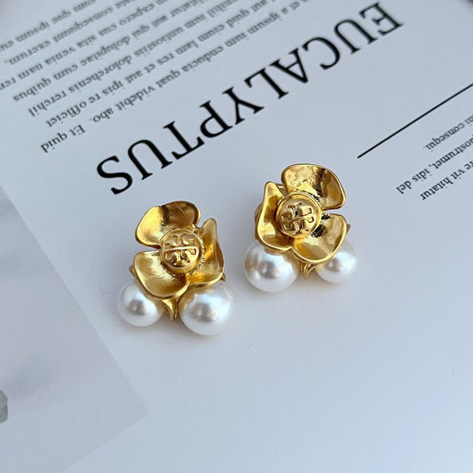 Gold-tone flower stud earrings with white pearl beads