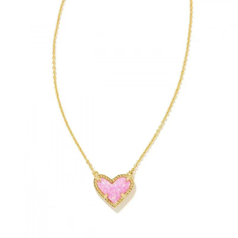 Heart pendant necklace with pink heart enamel and gold-tone chain