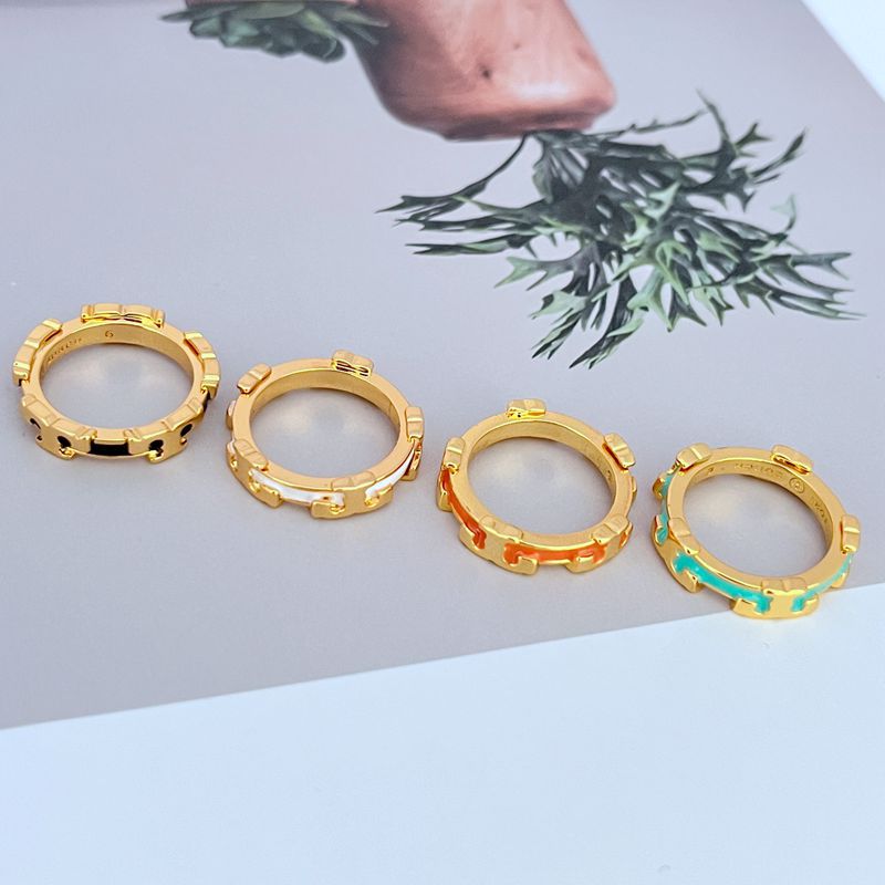 Gold enamel geometric circle ring set with multi-color enamel inlay on an open circular band