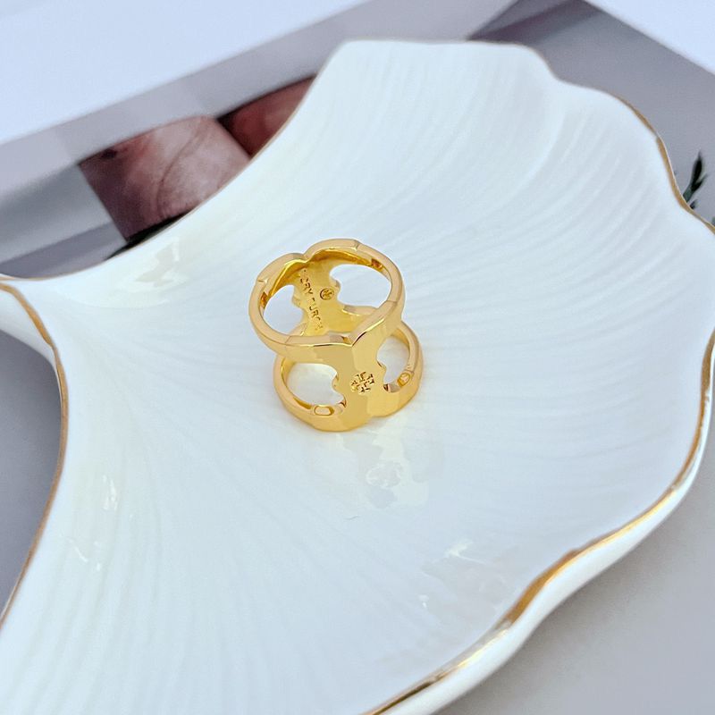 Gold wide sculpted metal ring, detailed openwork and cutout design