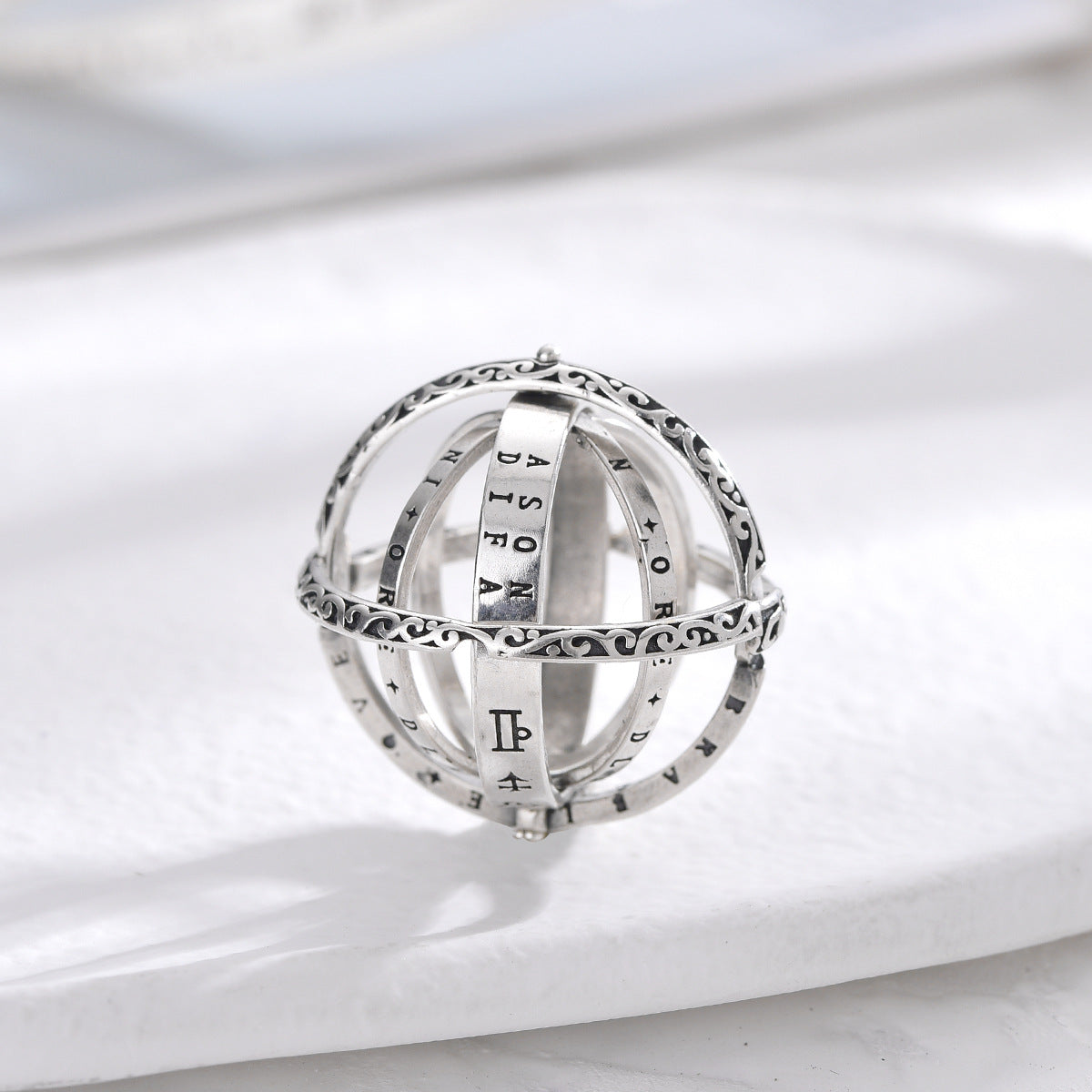S925 silver rotating ring with rune-style symbols and open multi-layer design