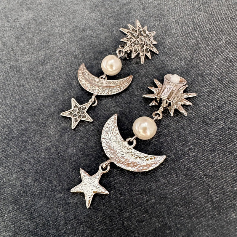 Silver-tone star and moon drop earrings with pearl beads and crystal pavé details