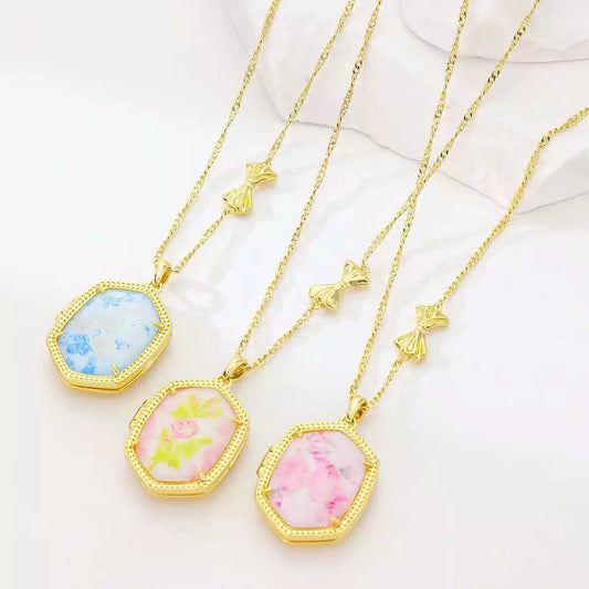Gold-plated pendant necklace set with blue, lime, and pink floral octagon pendants