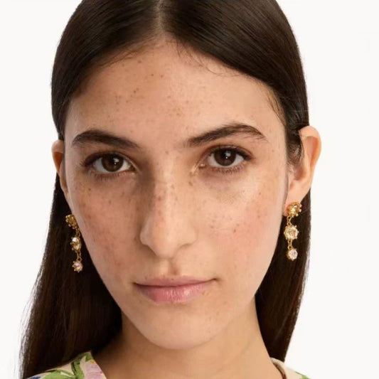 Goldtone round crystal drop earrings with pink stones, seen on model