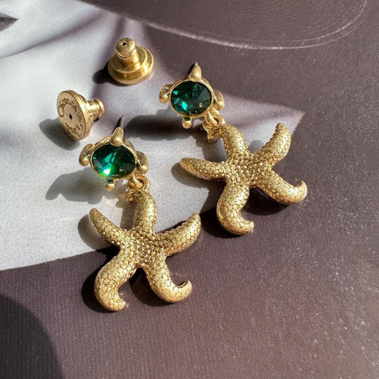 Vintage gold starfish stud earrings with green round accents
