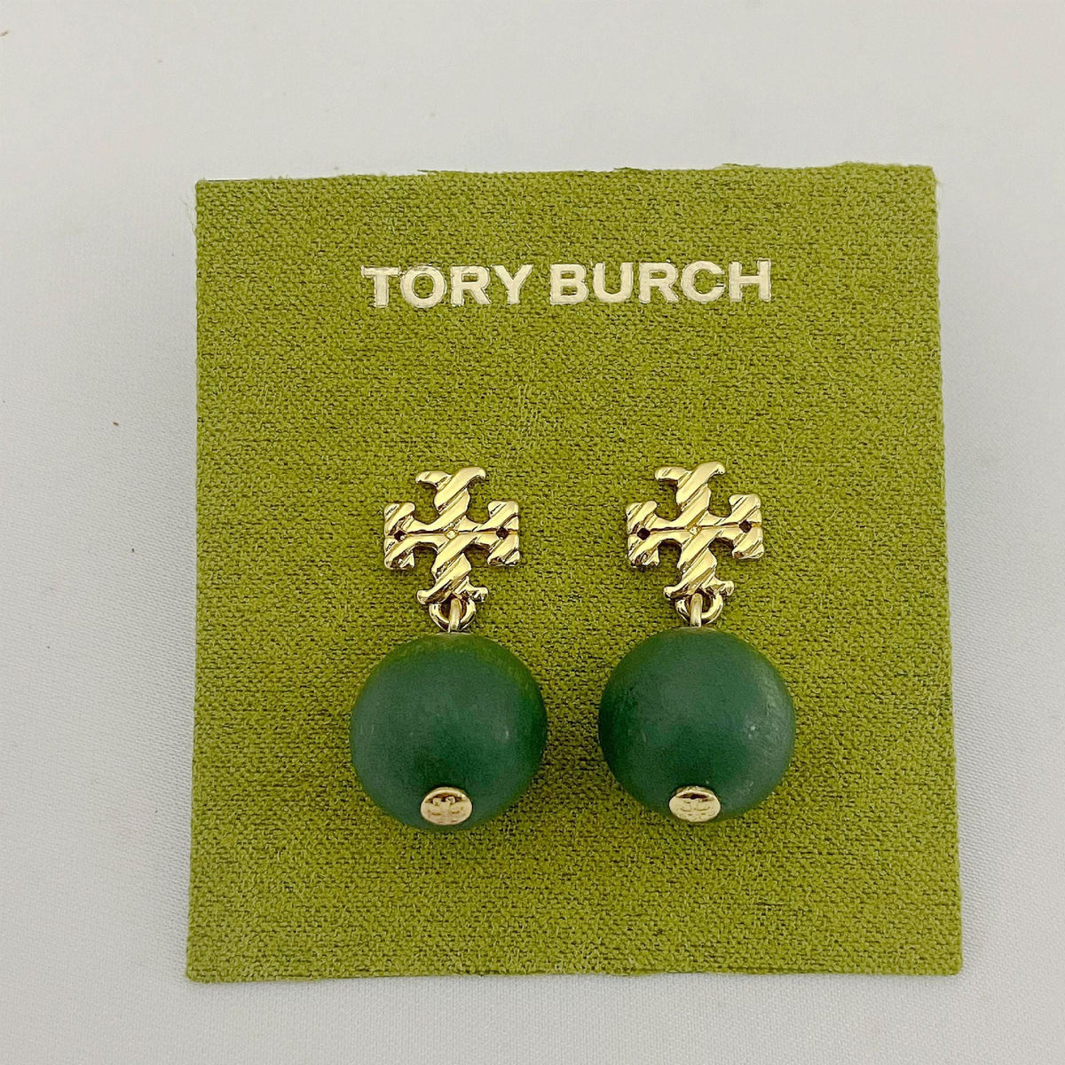 Tory Burch logo beaded pendant earrings, green round beads, gold tone logo studs