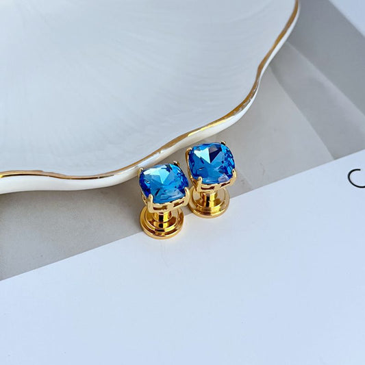 Gold-tone square stud earrings with blue rhinestone squares
