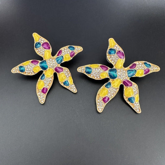 Starfish flower earrings with yellow, purple, and blue enamel and rhinestone detailing