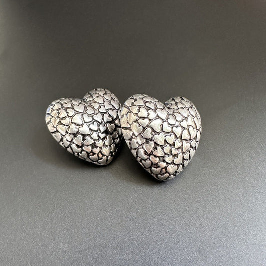 Vintage silver heart stud earrings with textured pattern, pair of two