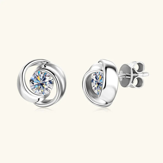 White gold moissanite stud earrings with round swirling halo setting and 925 posts