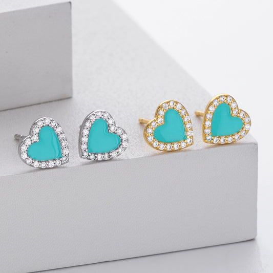 Heart stud earrings set showing silver and gold-tone styles with turquoise centers and clear stones.