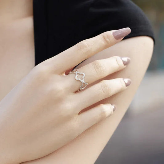 Silver-tone adjustable clover CZ fashion ring with openwork flower design