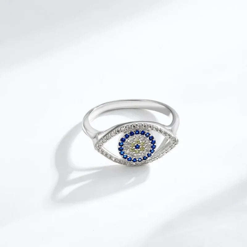 Sterling silver oval evil eye ring with blue CZ border and central blue stone