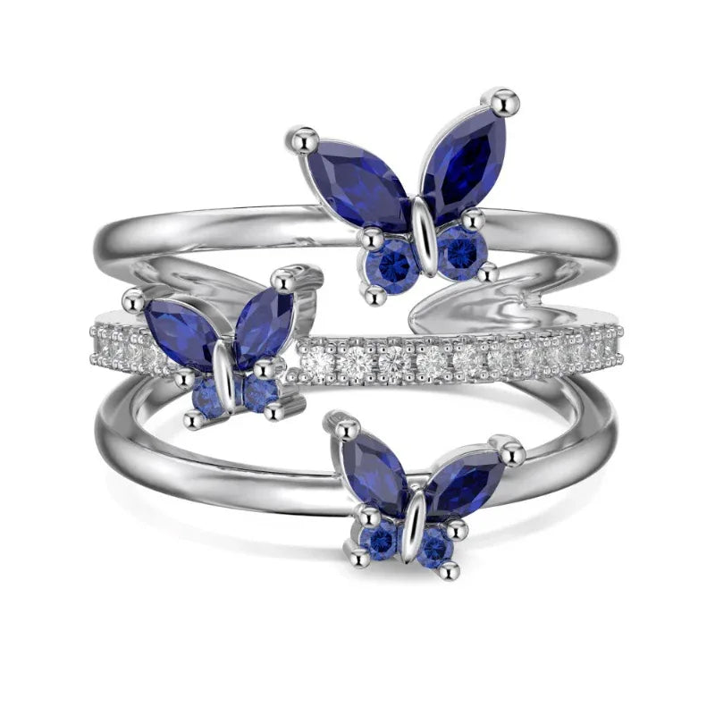 Marquise butterfly eternity ring in silver with blue marquise stones