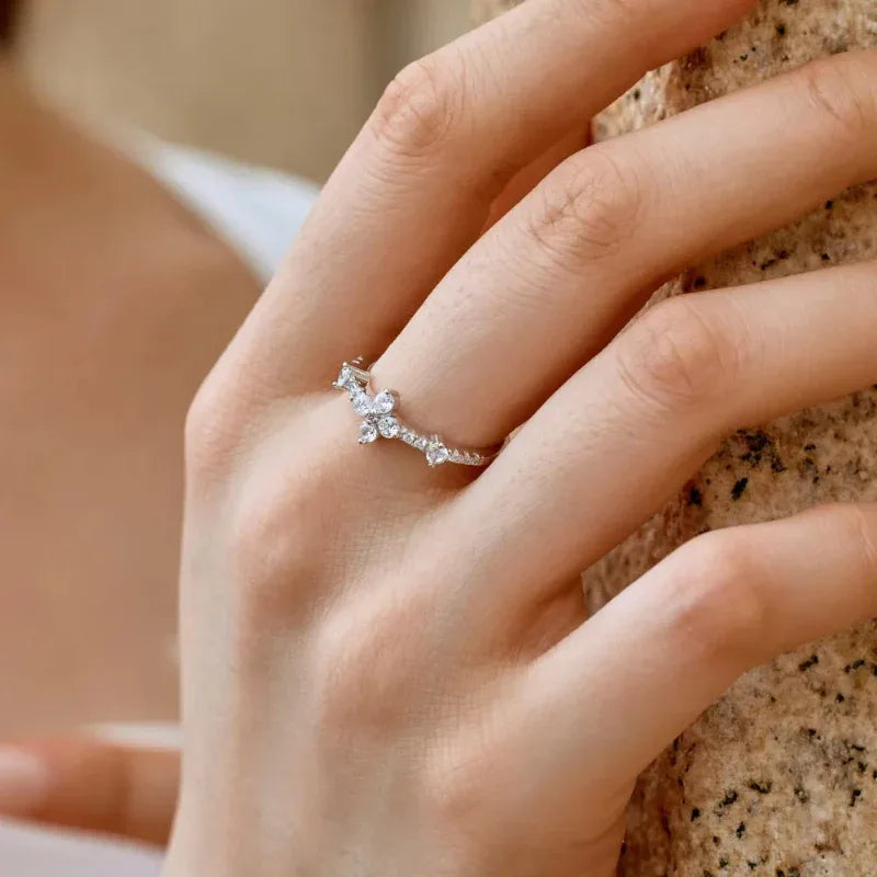 Four-leaf clover CZ ring with four round stone leaves in rhodium-plated sterling silver