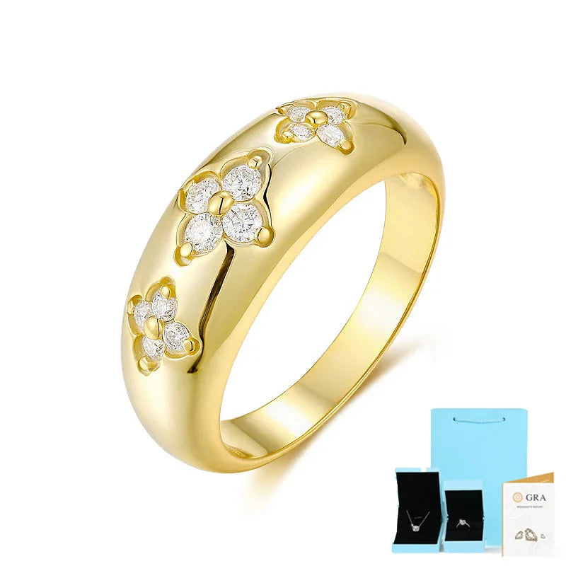 Gold-tone moissanite ring with multiple flower clusters across the band.