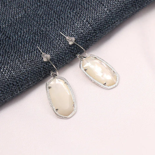 Silver-tone oval opal drop dangle earrings with hook back and pavé edging