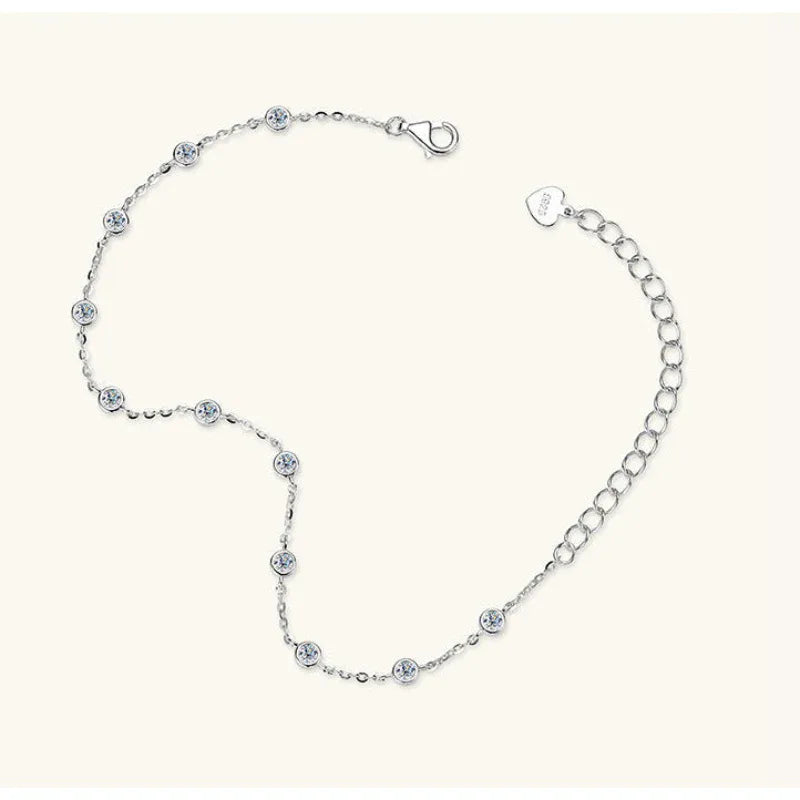 Silver tennis bracelet with evenly spaced small round blue stones