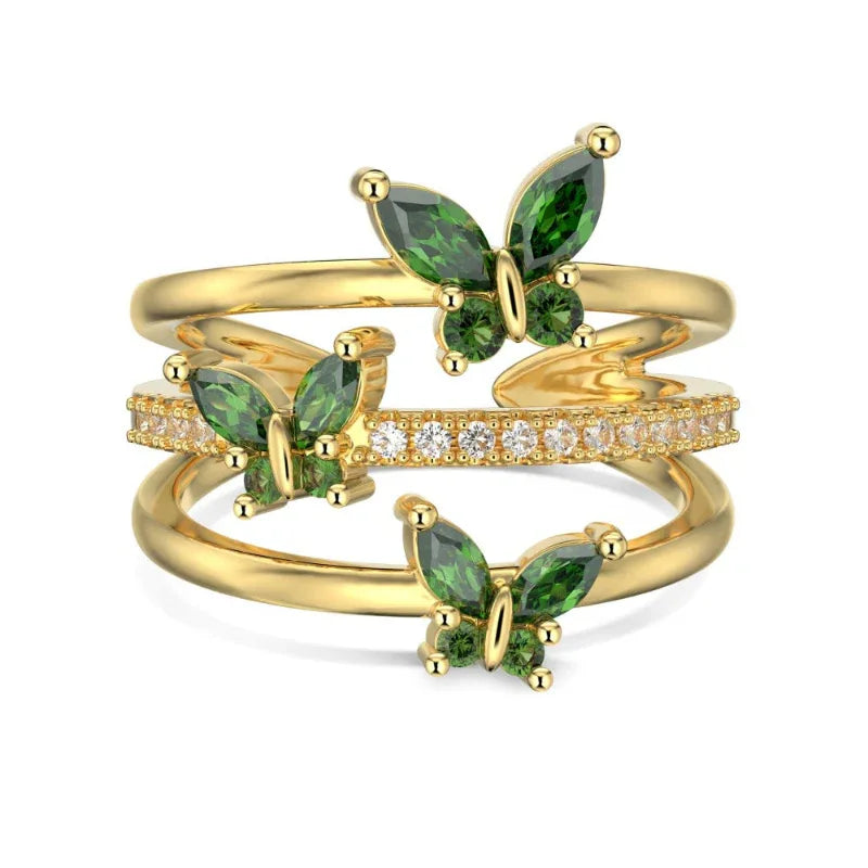 Marquise butterfly eternity ring in gold with green marquise stones