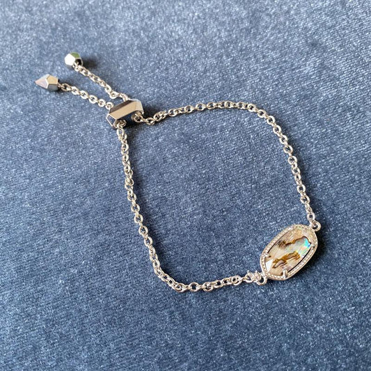 Silver chain bracelet with oval multicolor cameo pendant and small star charms