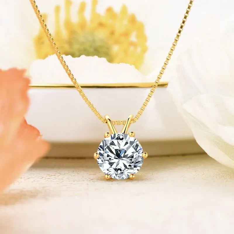 Gold-tone moissanite pendant necklace with round bezel-set stone and link chain