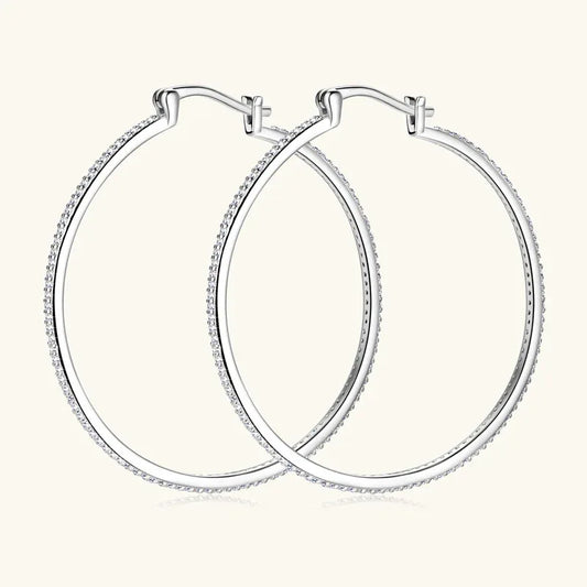 Pair of large oval hoop earrings with white gold pavé stone surround and clasp
