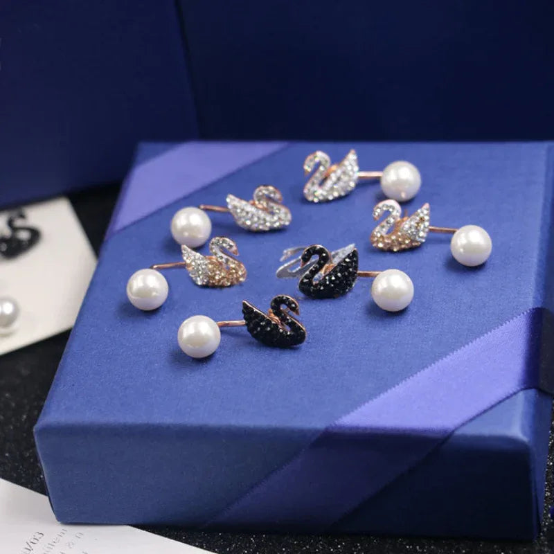 Swan stud earrings with crystal pavé and white pearls, silver-tone and black swan pair