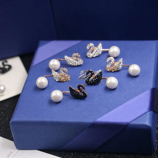 Swan stud earrings with crystal pavé and white pearls, silver-tone and black swan pair